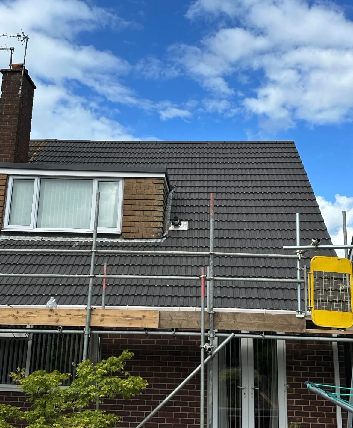 Completed pitched tile roof on a Coventry home, installed by Coventry Roofing Group